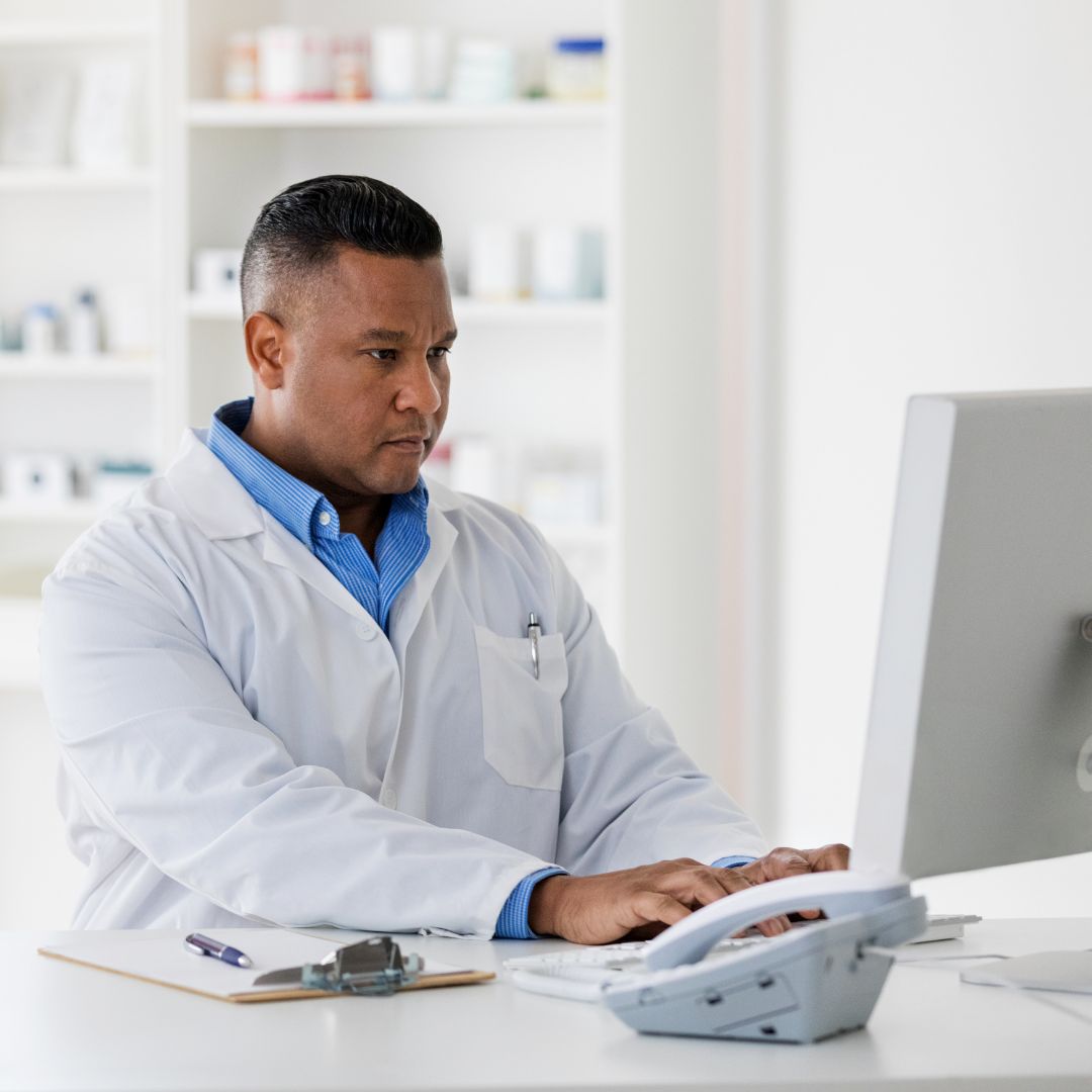 pharmacist at computer