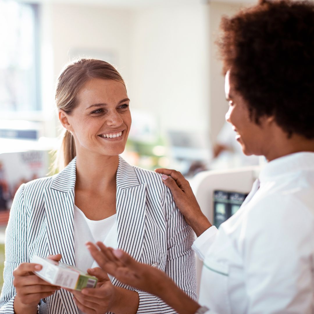 pharmacist speaking to a patient